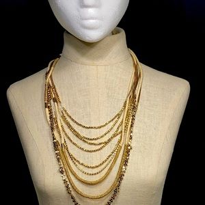 Nine strands of a combination of pearls, beads and  mesh that layers beautifully